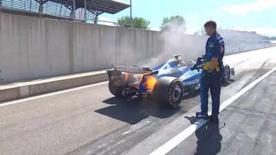 Carlos Sainz's F1 car ablaze during the Austrian Grand Prix