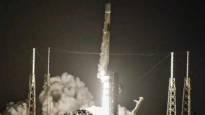 Falcon 9 rocket carrying Starlink satellites lifts off.
